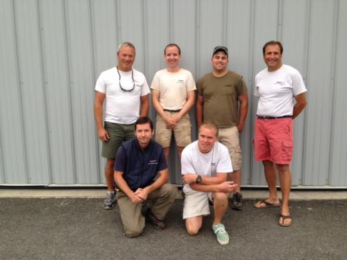 Team members in front of building