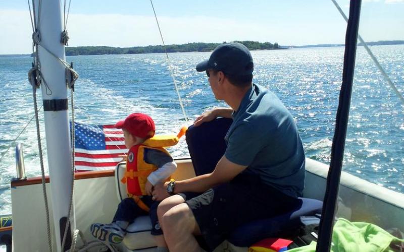 Man and boy on sailboat