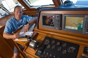 Technician installing a marine electronic system Technician installing a marine electronic system