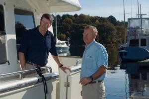 Two men talking on boat at Yankee Marina & Boatyard Two men talking on boat at Yankee Marina & Boatyard