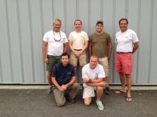 Team members in front of building